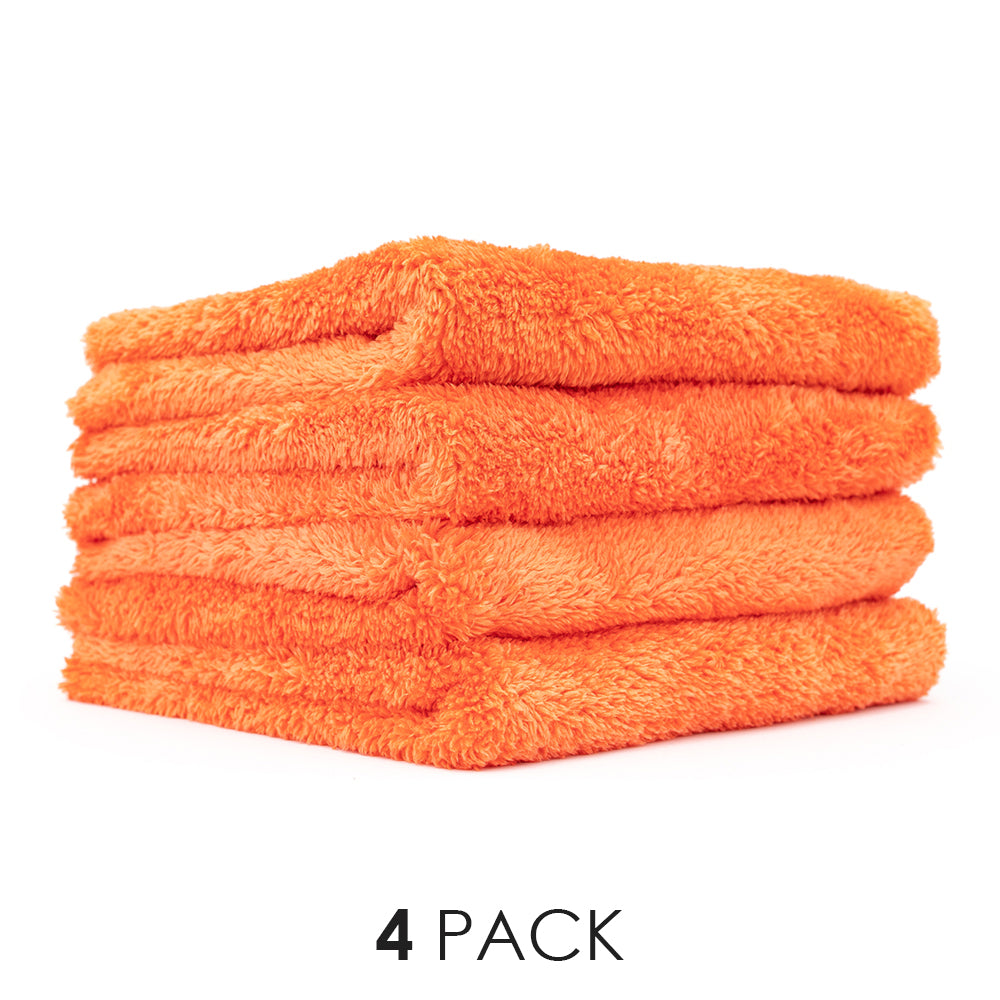 A picture of a 4-pack of Orange Eagle Edgeless towels from The Rag Company